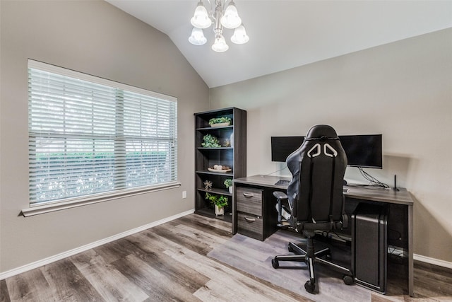 office with a chandelier, hardwood / wood-style floors, and lofted ceiling