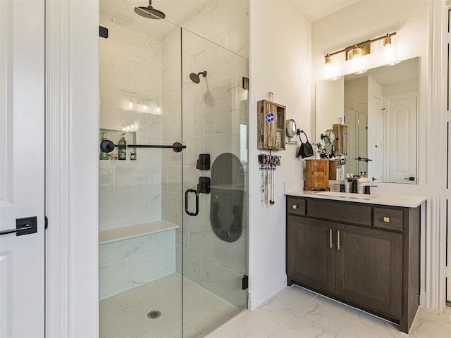 bathroom with a shower with door and vanity