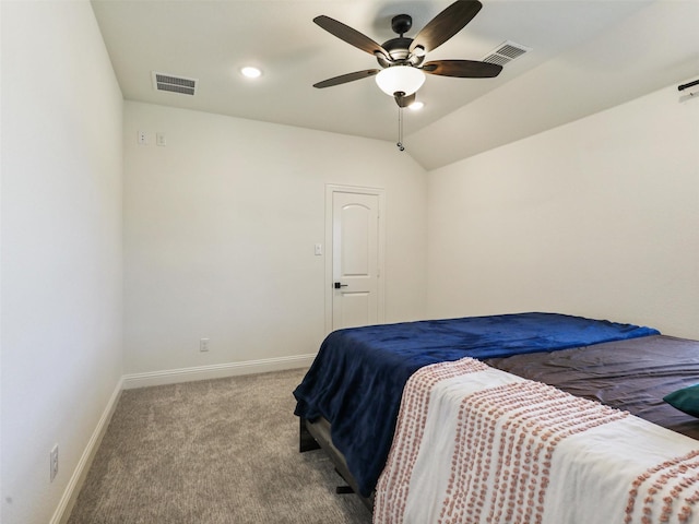 bedroom with light carpet, vaulted ceiling, and ceiling fan