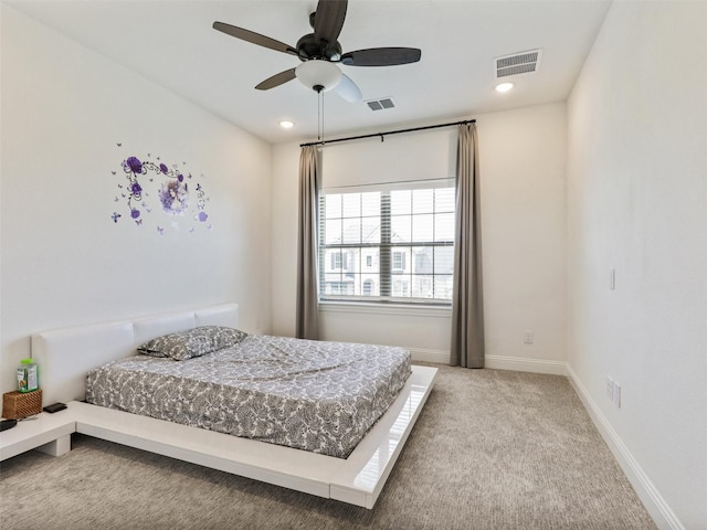 carpeted bedroom with ceiling fan