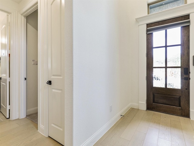 foyer with light wood-type flooring