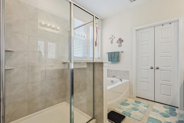 bathroom with separate shower and tub