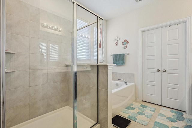 2133 Miramar Dr, Little Elm, TX 75068 - full bathroom with a bath, a stall shower, and tile patterned flooring