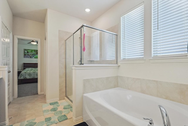 bathroom featuring tile patterned floors and independent shower and bath