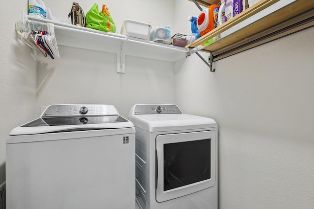 laundry room with separate washer and dryer