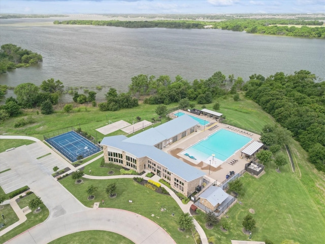 birds eye view of property with a water view