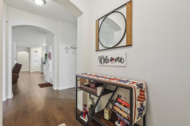 hall with dark wood-type flooring