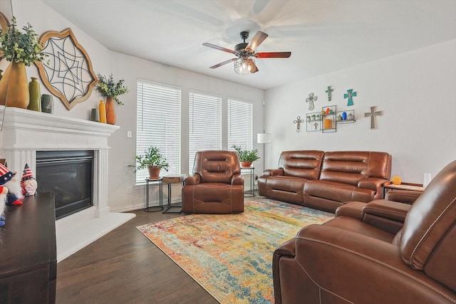 living room featuring dark hardwood / wood-style floors and ceiling fan