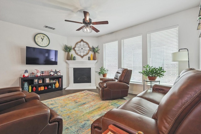 2133 Miramar Dr, Little Elm, TX 75068 - living area featuring ceiling fan and a glass covered fireplace