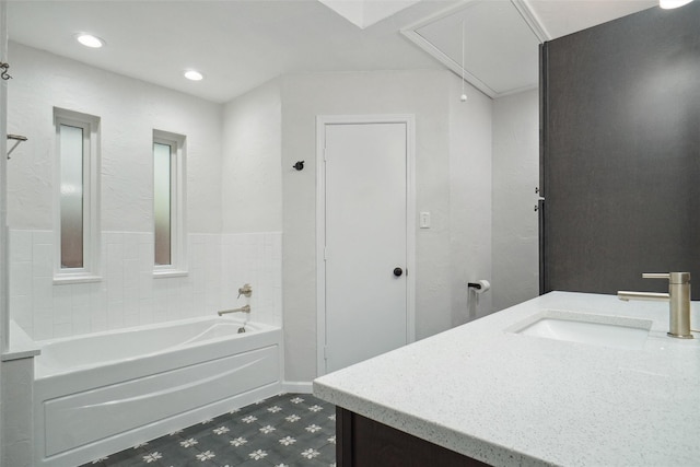 bathroom featuring vanity and shower / bathtub combination