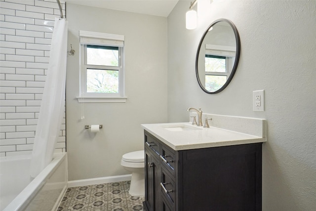 full bathroom with vanity, shower / tub combo, and toilet