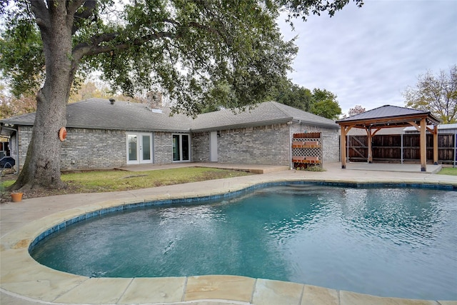 view of swimming pool featuring a gazebo