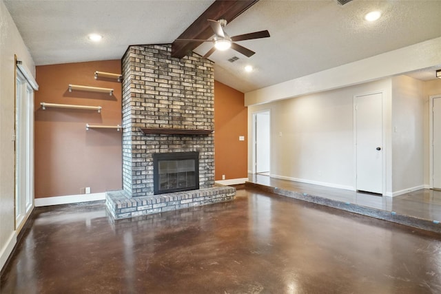 unfurnished living room with ceiling fan, a fireplace, lofted ceiling with beams, and a textured ceiling