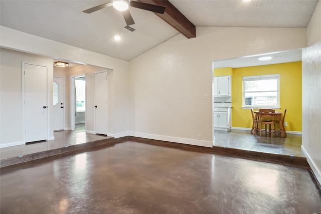 unfurnished room with ceiling fan and vaulted ceiling with beams