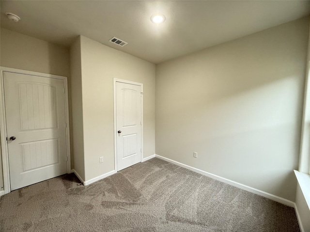 unfurnished bedroom featuring carpet flooring