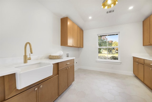 kitchen with light tile patterned flooring and sink