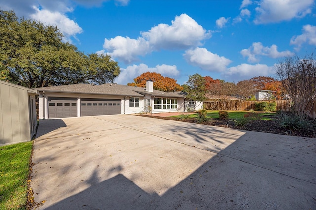 single story home featuring a garage