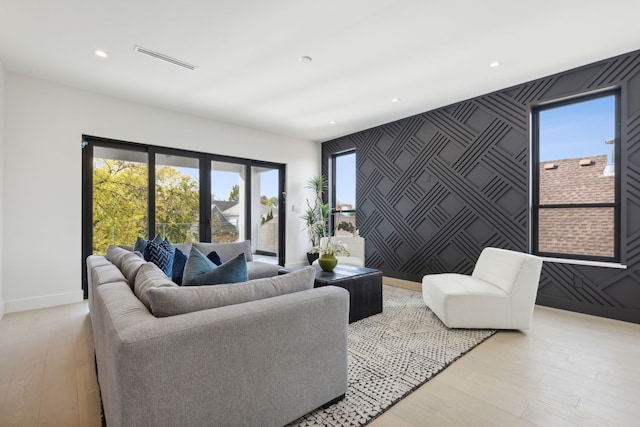 living room with light hardwood / wood-style floors