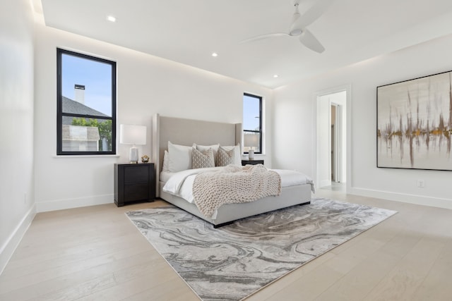 bedroom featuring ceiling fan and light hardwood / wood-style flooring