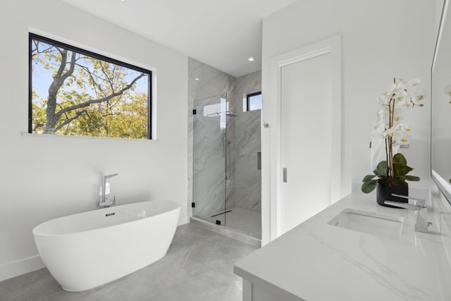 bathroom with separate shower and tub and vanity