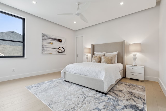 bedroom with ceiling fan and wood-type flooring