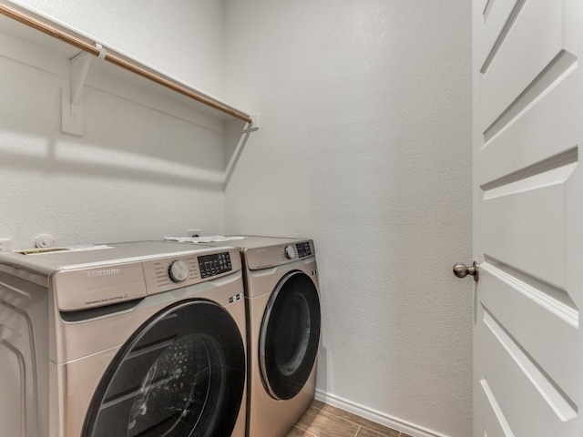 washroom with washing machine and dryer