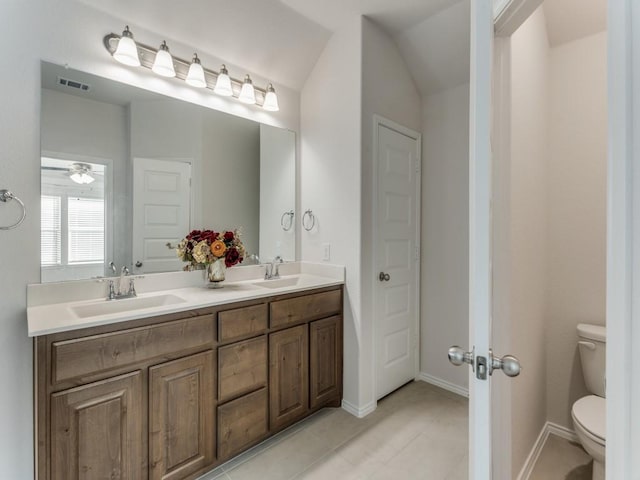 bathroom featuring vanity, ceiling fan, and toilet