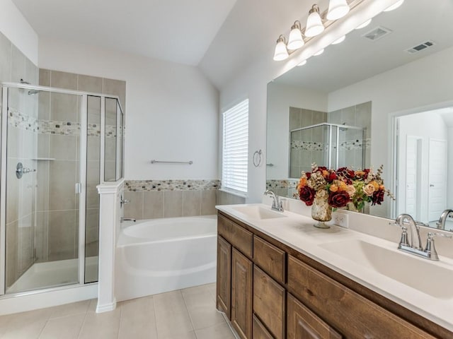 bathroom with tile patterned floors, plus walk in shower, vanity, and lofted ceiling