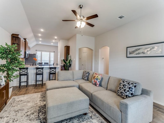 living room with ceiling fan and wood-type flooring