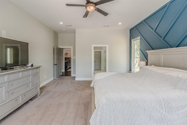 bedroom with ceiling fan and light colored carpet