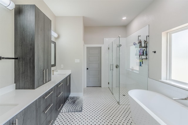 bathroom featuring vanity and shower with separate bathtub