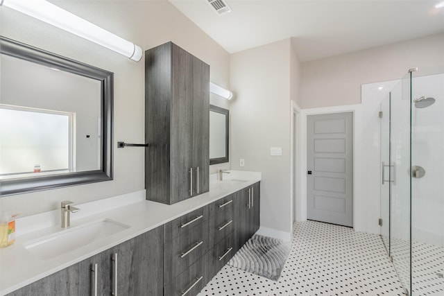 bathroom featuring vanity and an enclosed shower