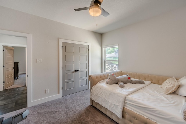 bedroom featuring dark carpet and ceiling fan