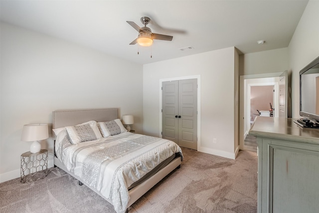 carpeted bedroom with a closet and ceiling fan