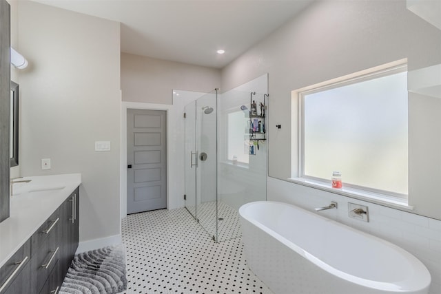 bathroom with separate shower and tub and vanity