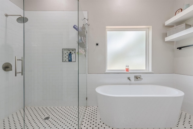 bathroom featuring tile patterned floors and plus walk in shower