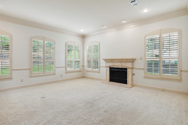 unfurnished living room featuring light carpet and ornamental molding