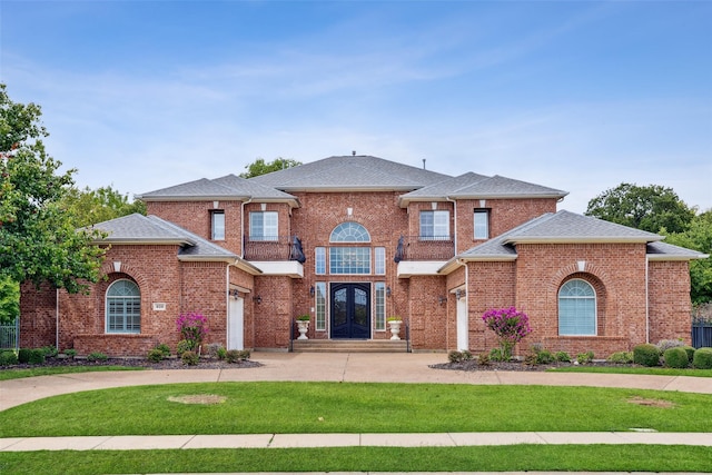 view of front of property featuring french doors and a front yard