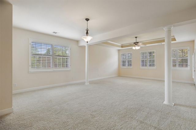 spare room with light carpet, plenty of natural light, and ceiling fan