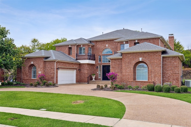 view of front of property with a garage and a front yard