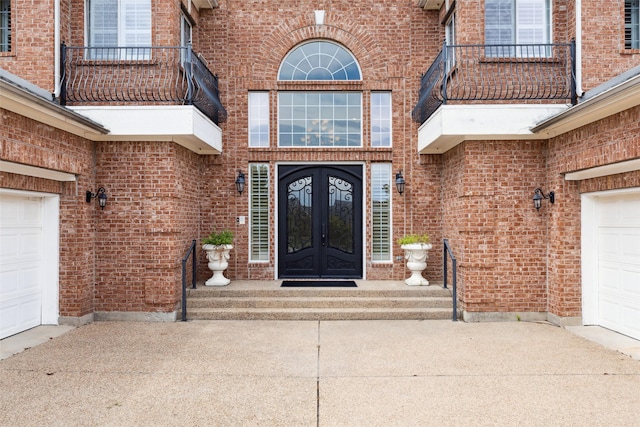 entrance to property featuring french doors and a balcony