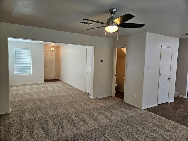 carpeted empty room with ceiling fan