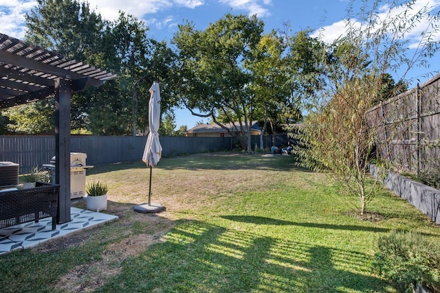 view of yard featuring a pergola and central AC unit