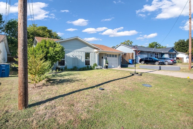 single story home featuring a garage and a front lawn