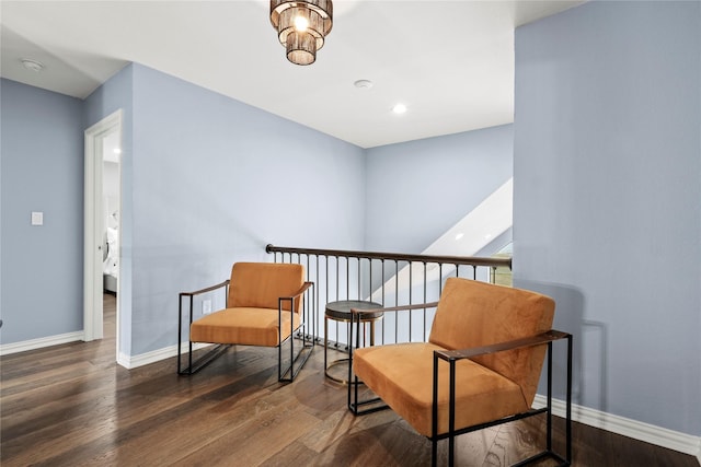 living area with dark hardwood / wood-style flooring