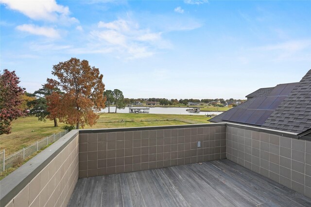 wooden deck with a water view