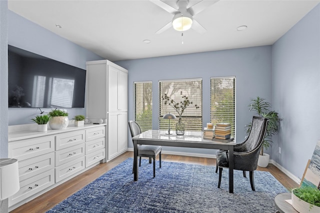 office space with wood-type flooring and ceiling fan