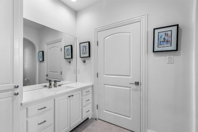 bathroom featuring tile patterned floors and vanity