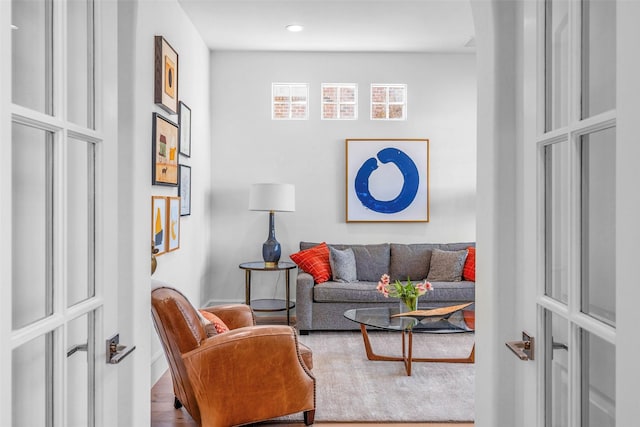 living room with hardwood / wood-style floors and french doors