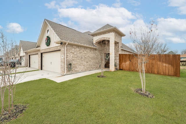 view of front of home featuring a garage and a front lawn